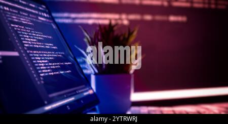 Work from home. Programmer coding code on notebook screen at Stock Photo