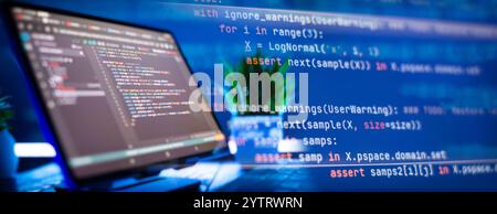Work from home. Programmer coding code on notebook screen at Stock Photo