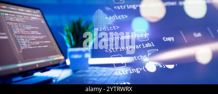 Work from home. Programmer coding code on notebook screen at Stock Photo