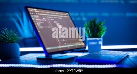 Work from home. Programmer coding code on notebook screen at Stock Photo