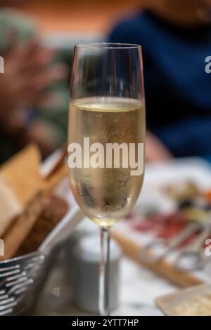 A glass of Prosecco or sparkling wine on the table Stock Photo