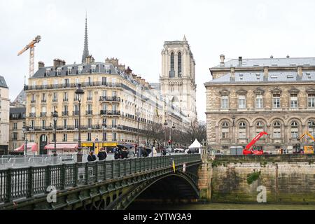 Paris, France. 8th Dec 2024. Atmosphere around Notre Dame during the first mass for the public in which Archbishop of Paris will lead prayers to consecrate the new main alter, at the Notre-Dame de Paris cathedral, in Paris, on December 8, 2024. Newly restored Notre Dame cathedral is set to hold its first service for the public on December 8, 2024 after a historic re-opening ceremony that saw firefighters, builders and artists celebrated for their work saving the 12th-century masterpiece. Credit: Abaca Press/Alamy Live News Stock Photo