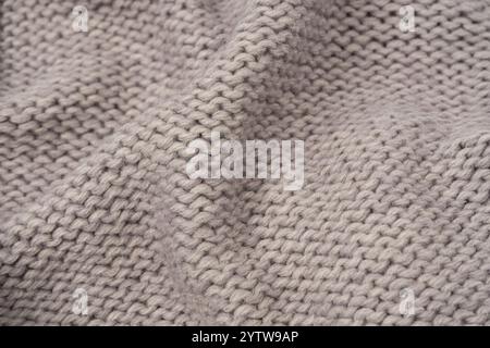 Grey wool sweater texture as a background. Top view. Stock Photo