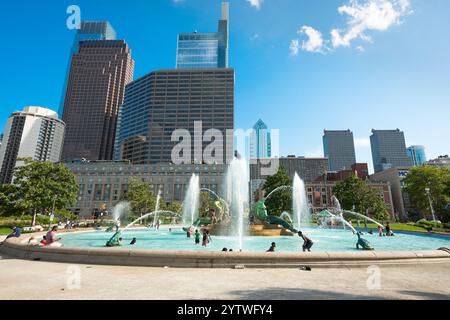 Logan Square fountain, view of young people playing in the Logan Square fountain on a summer day in central Philadelphia, Pennsylvania, PA, USA. Stock Photo