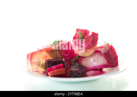 pickled cabbage with beets and carrots, in a plate, isolated on white background . Stock Photo