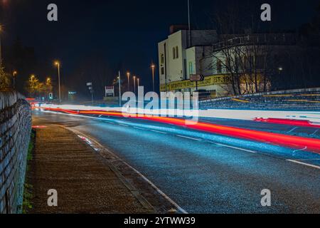Light Traffic Over The Bridge-A Light Trails Image over a low bridge at night Stock Photo