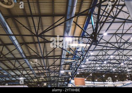 The ceiling of an industrial hangar illuminated by fluorescent lamps Stock Photo