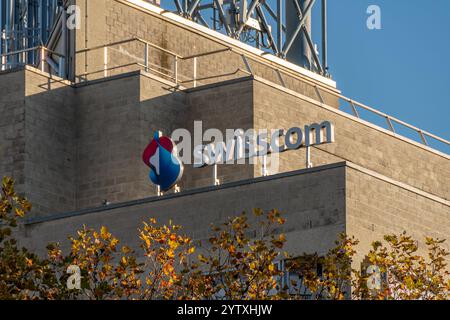 Sign and logo on a Swisscom telecommunications center. Swisscom AG is a public company and one of the leading Swiss telecommunications providers Stock Photo