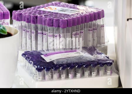 Vacuum blood collection tubes with purple caps to preserve blood cell elements in an unchanged state, packaged in protective film Stock Photo