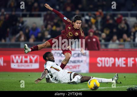 Rome, Italy. 7th Dic, 2024. Paulo Dybala of Roma kicks the ball under pressure from Kialonda Gaspar of Lecce during the Italian championship Serie A f Stock Photo