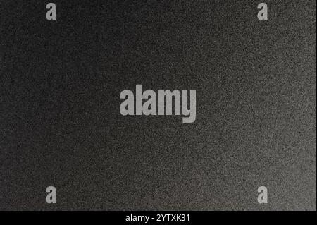 Surface of dark gripy metal with sparkle dots close up view Stock Photo