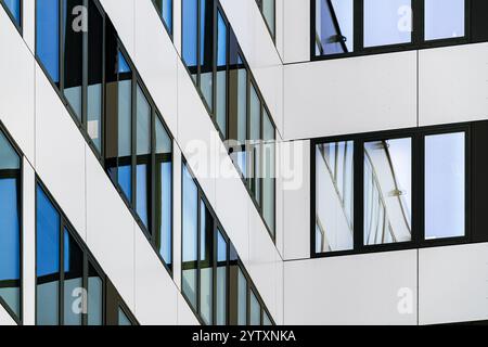 Modern Office Building Facade with Geometric Glass Windows and Contemporary Architectural Design Stock Photo