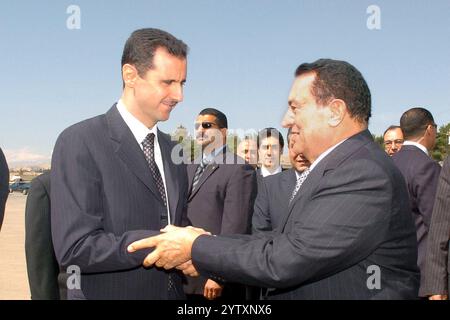 Damascus, Syria. 08th Dec, 2024. In just over ten days, Syrian rebels have taken control of Syria's main cities, including the capital Damascus on Saturday night. President Bashar al-Assad, in power since 2000, has fled the country, according to Russia - FILE - FILE PHOTO - Syrian president Bashar Al Assad (L) receives his Egyptian counterpart Hosni Moubarak in Damascus, Syria, on March 15, 2005, as Syria is facing intense pressure from the U.S. and western countries for its political and military presence in Lebanon. Photo by Balkis Press/ABACA. Credit: Abaca Press/Alamy Live News Stock Photo