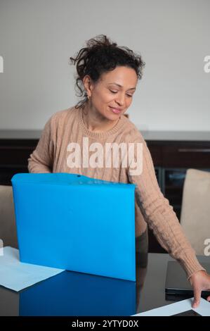 Office organization and administration, businesswoman arranging folders ...
