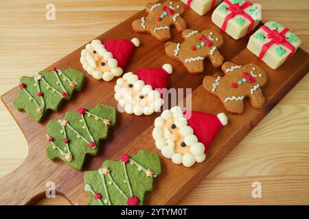 Rows of Assorted Homemade Christmas Cookies on Wooden Breadboard Stock Photo