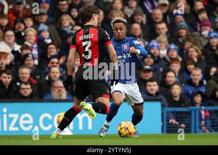 Ipswich, UK. 07th Dec, 2024. Ipswich Town's Omari Hutchinson battles for the ball against Bournemouth's Milos Kerkez during the Ipswich Town FC v AFC Bournemouth English Premier League match at Portman Road, Ipswich, England, United Kingdom on 8 December 2024 Credit: Every Second Media/Alamy Live News Stock Photo