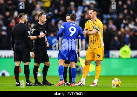 King Power Stadium, Leicester, UK. 8th Dec, 2024. Premier League Football, Leicester City versus Brighton and Hove Albion; Captains Jamie Vardy of Leicester and Lewis Dunk of Brighton shake hands before kick-off as referee Stuart Attwell looks on Credit: Action Plus Sports/Alamy Live News Stock Photo