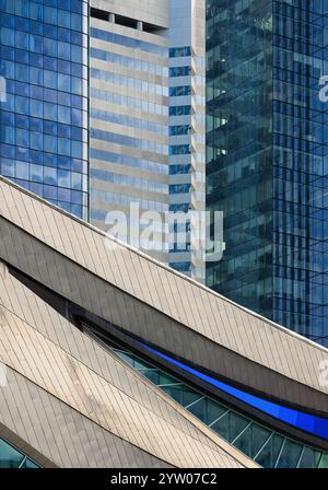 Rogers Place, home of the Oilers, in foreground of modern blue glass skyscrapers in downtown Edmonton, Alberta Stock Photo