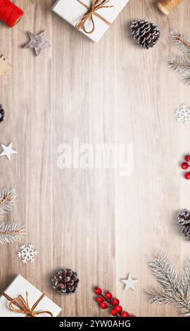 Top view Christmas composition with gifts and decorations at the top and bottom, featuring an empty space in the center, perfect for holiday greetings Stock Photo