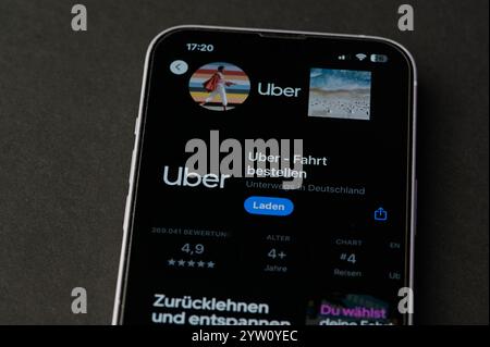 Mainz, Germany - Oct 24, 2024: icon of the Uber app on a German smartphone in app store Stock Photo