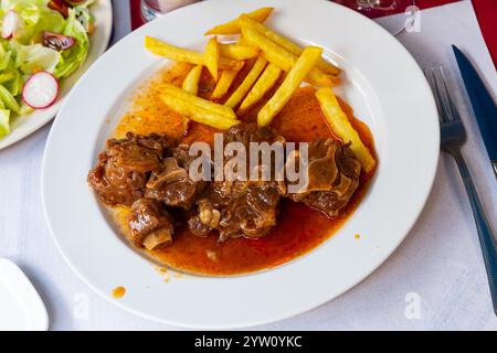 Oxtail in sauce - Rabo de toro. Spanish dish Stock Photo