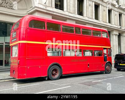 London, England, UK - 3 July 2024: Vintage red double decker bus of London Transport driving on a road in central London Stock Photo