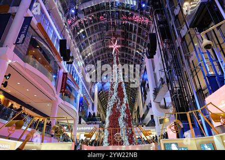 Toronto, Canada - December 8, 2024:  Toronto's Eaton Center is a multi-level indoor mall, with bright Christmas decorations Stock Photo