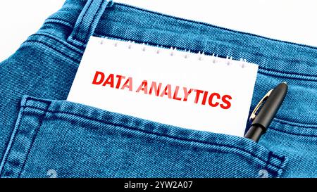 The concept of technology and development. Phrase, words, text DATA ANALYTICS inscription in the pocket of jeans on a piece of paper. Stock Photo