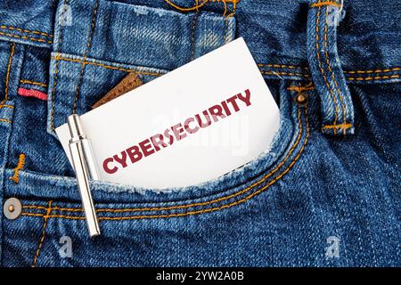 The concept of technology and development. Phrase, words, text CYBERSECURITY a hint on a piece of paper from your pocket. Stock Photo