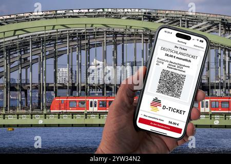 Symbolic image of Deutschlandticket, new from 2025 for 58 euros per month, ticket on mobile phone app, travel on regional transport throughout Germany Stock Photo