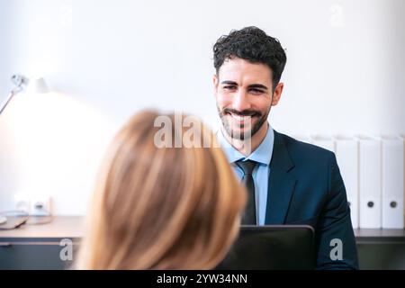 Professional business meeting between two colleagues in a bright office. Stock Photo
