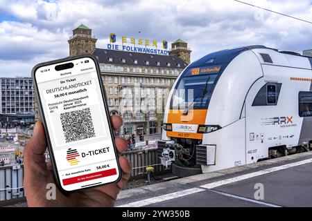 Symbolic image of Deutschlandticket, new from 2025 for 58 euros per month, ticket on mobile phone app, travel on regional transport throughout Germany Stock Photo