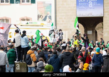 Syrians celebrate after Assad regime toppled, war in the middle east, rebels and islamists, Porta Nigra in Trier, Germany, 08.12.2024 Stock Photo