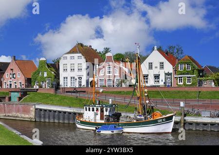 The harbour of Greetsiel, fishing boat, Frisian houses, East Frisia, Lower Saxony East Frisia, Lower Saxony, Federal Republic of Germany Stock Photo