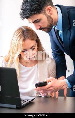 Business Colleagues Collaborating with Smartphone in Modern Office.Vertical Stock Photo
