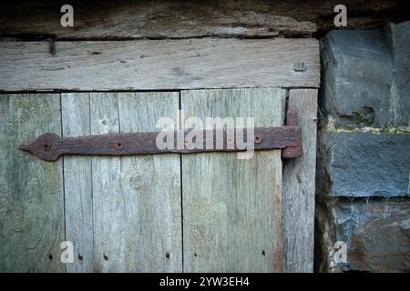vintage rusty hinge on an old barn door Stock Photo