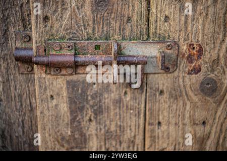 old iron bolt on a barn door Stock Photo