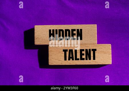 Hidden talent message written on wooden blocks with purple background. Conceptual hidden talent symbol. Copy space. Stock Photo