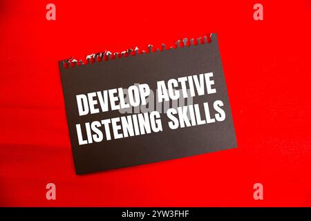 Develop active listening skills message written on white paper with ...