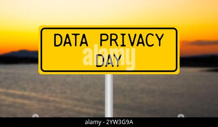 Data privacy day message written on yellow sign with blurry lake background. Conceptual data privacy day symbol. Copy space. Stock Photo