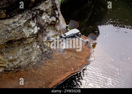 drone flying over natural waterhole, hobby recreation activity, national park sightsee photography videography Stock Photo