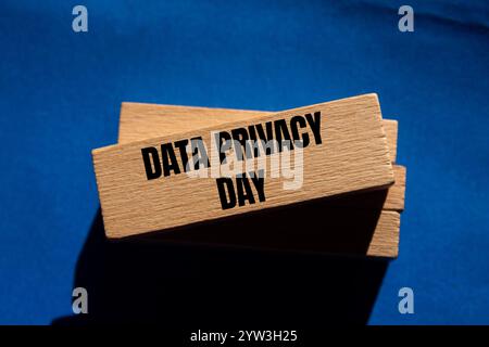 Data privacy day message written on wooden blocks with blue background. Conceptual data privacy day symbol. Copy space. Stock Photo