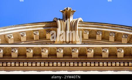 Murcia, Spain - October 25, 2024: Ancient architectural decoration on a stone wall facade of a medieval building. Stock Photo
