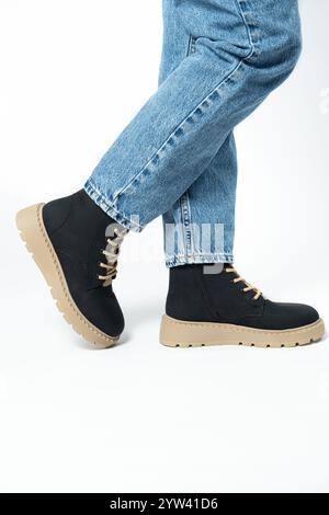 High boots, trendy winter shoes, isolate close-up place for text. Stock Photo