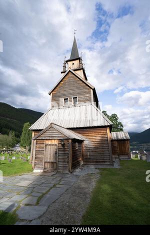 Kaupanger Stave Church, a 12th century Viking stave church in Sogn og Fjordane province, Norway, with no people and a spectacular sky. Cultural touris Stock Photo