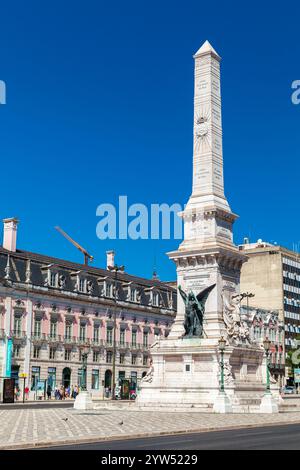 Lisbon, Portugal - August 12, 2017: Monument to the Restorers. Street view of Restauradores Square of Lisbon on a sunny summer day, vertical photo Stock Photo