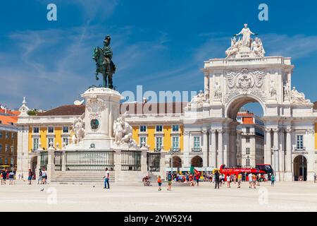 Lisbon, Portugal - August 12, 2017: Street photo taken at Commerce Square on a sunny day with tourists walk near the Statue of King Jose I, by Machado Stock Photo