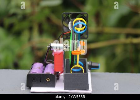 3d printed bubble blower device side view with visible batteries and dc gear motor Stock Photo
