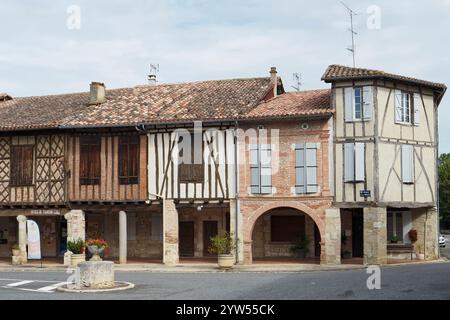 ancient half timbered buildings surround the Halle de Cologne in the bastide of Cologne, Gers, France,Europe Stock Photo