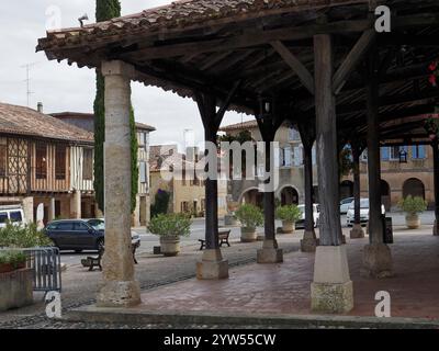 ancient half timbered buildings surround the Halle de Cologne in the bastide of Cologne, Gers, France,Europe Stock Photo